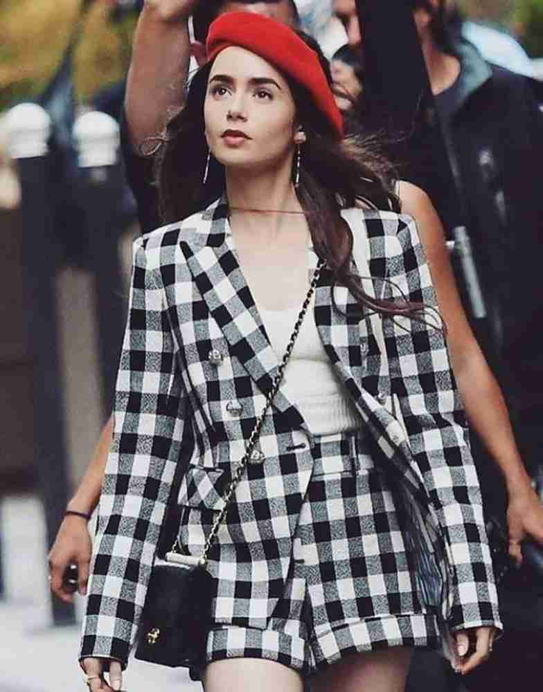 Emily in Paris Lily Collins wearing black and white checkered blazer on set