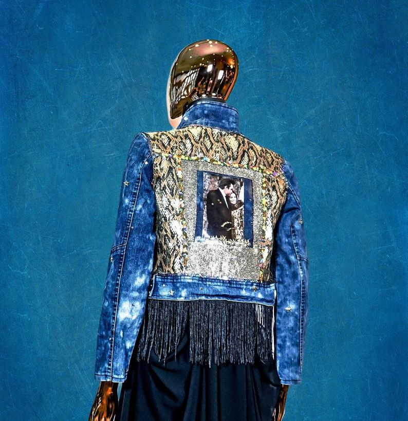 Back view of Johnny Cash Sequin Embellished Denim Jacket with a picture of June and Johnny Cash encapsulated in star snow globe style