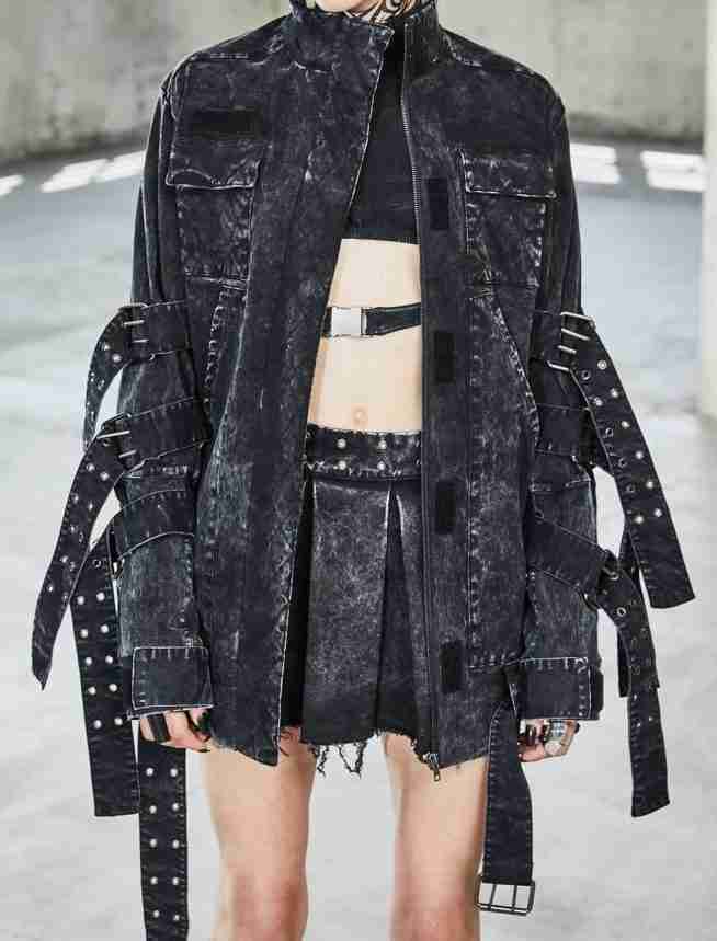 Washed denim black jacket worn by female model - front view