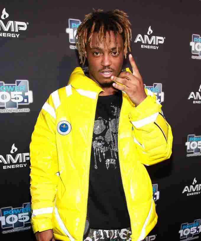 Juice Wrld in a yellow puffer jacket at the AMP Energy event