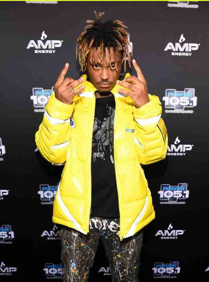 Juice Wrld at the AMP Energy event wearing a yellow puffer jacket