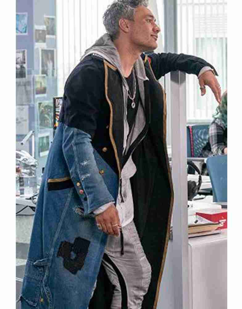 Taika Waititi as Antoine wearing a long black and blue denim coat for the film Free Guy