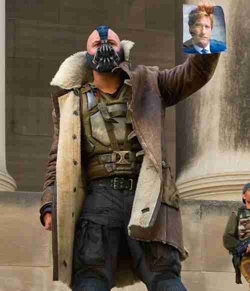Tom Hardy as Bane in Batman: The Dark Knight Rises wearing a brown shearling-lined leather coat