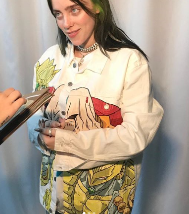 Billie Eilish wearing her printed Dio Brando white shirt style denim jacket