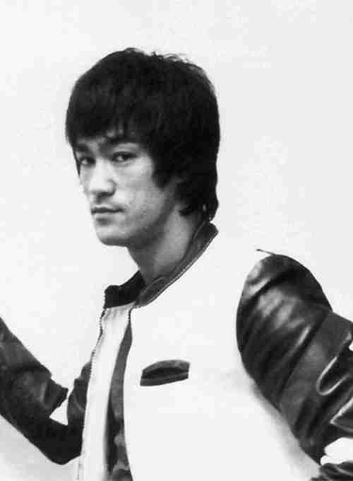 Bruce Lee in The Way Of The Dragon in a white leather jacket