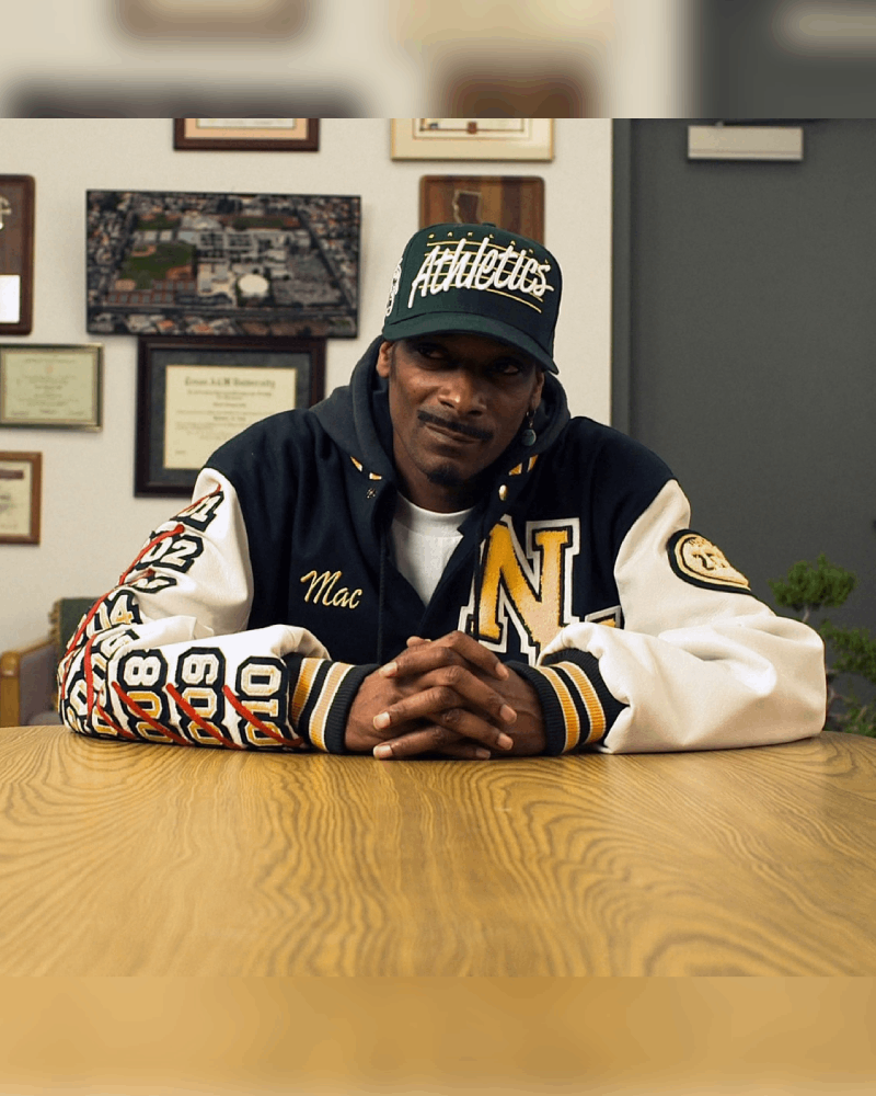 Snoop Dogg in Mac N Devin Go To Highschool wearing a N Hale High varsity jacket