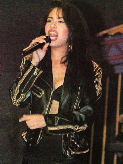 Selena Quintanilla in an embroidered black leather jacket performing live
