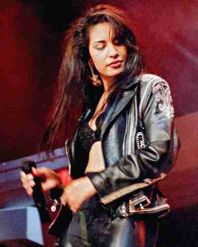 Selena Quintanilla performing live wearing an embroidered black leather jacket