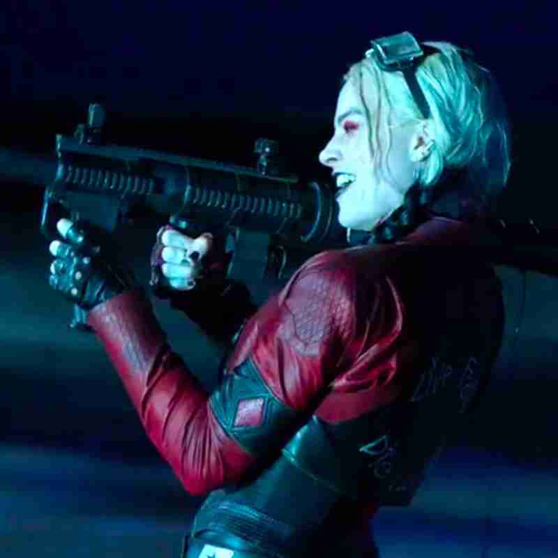 Harely Quinn (Margot Robbie) from Suicide Squad 2 wearing a cropped multi-colored red and black leather jacket