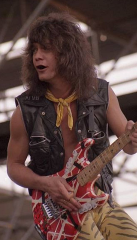 Eddie Van Halen rocking in his black leather vest