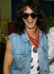 Eddie Van Halen wearing a blue denim vest