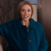 Elizabeth Olsen wearing a blue wool coat in the WandaVision TV series
