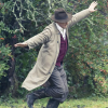 Hugh Bonneville in To Olivia as Roald Dahl in a beige long coat