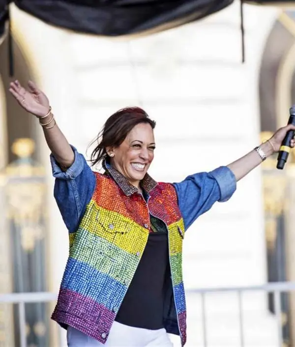 Kamala Harris seen wearing a rainbow colored denim jacket in a gay pride march