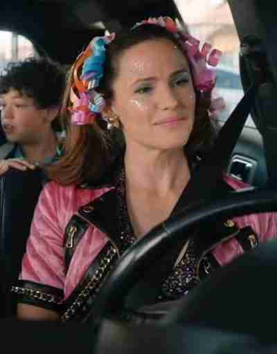 Allison Torres (Jennifer Garner) from the Yes Day 2021 movie in a pink satin jacket