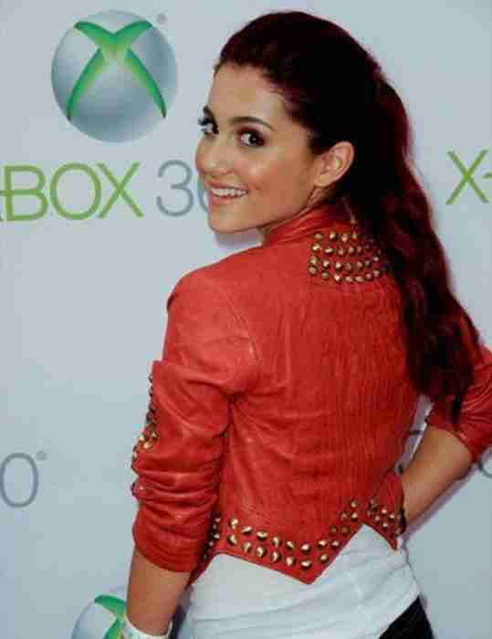 Ariana Grande seen wearing a cropped red leather studded jacket