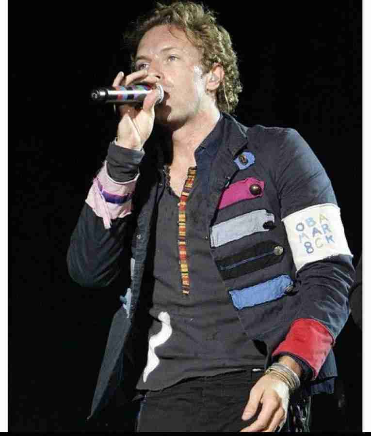 Chris Martin performing live in his Viva La Vida jacket
