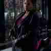 Queen Latifah as Robyn McCall wearing a black leather coat