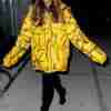 Ariana Grande in Oversized Yellow Puffer Jacket
