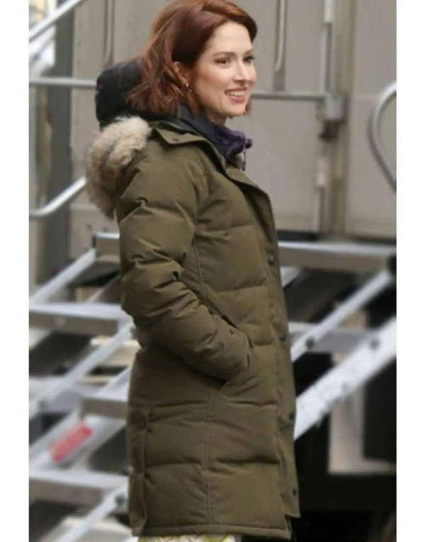 Ellie Kemper as Jenna Jones on the set of The Stand In wearing a green puffer coat
