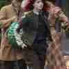 Emma Stone wearing a cotton jacket on the set of Cruella 2021 movie