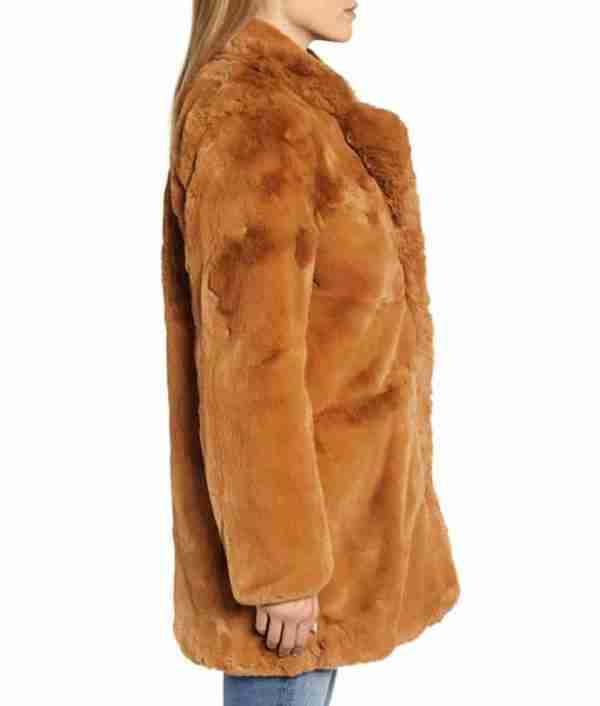 Side view of Melody Bayani's brown faux fur coat from The Equalizer 2021