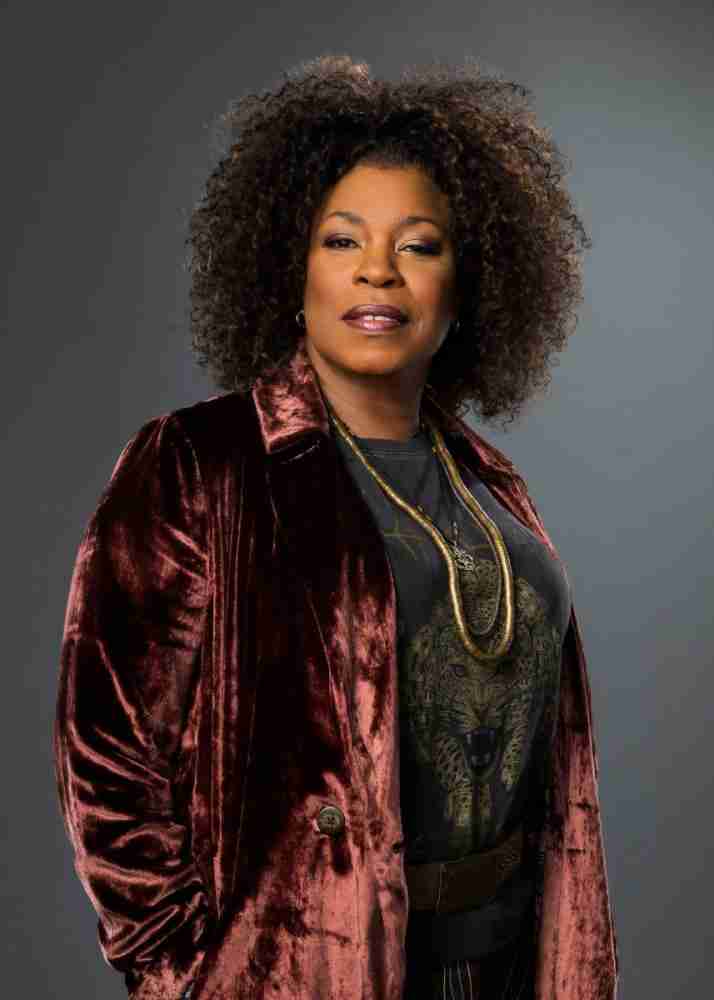 Lorraine Toussaint wearing a maroon velvet coat for The Equalizer 2021