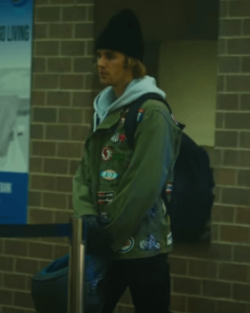 Justin Bieber wearing a green patch embroidered jacket in Hold On music video