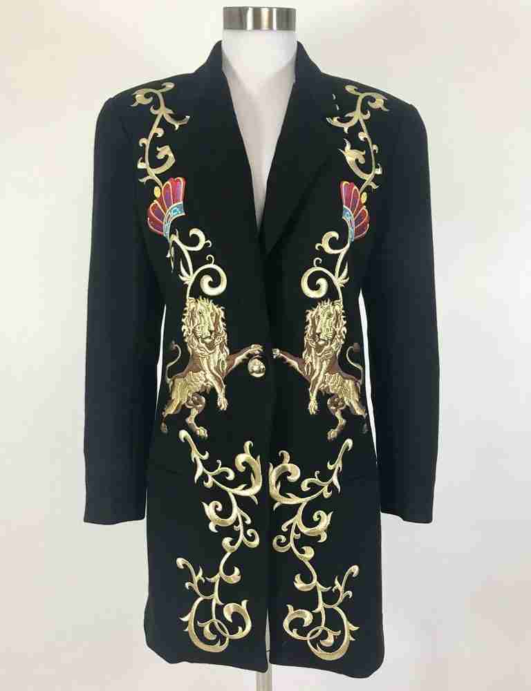Pure leather exterior Viscose lining Open front buttoned closure Notch lapel collar Full sleeves Front pockets Open hem cuffs Lion applique and patterns printed on the front