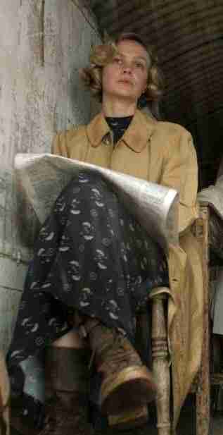 Edith Pretty (Carey Mulligan) in a yellow coat featuring in The Dig TV series