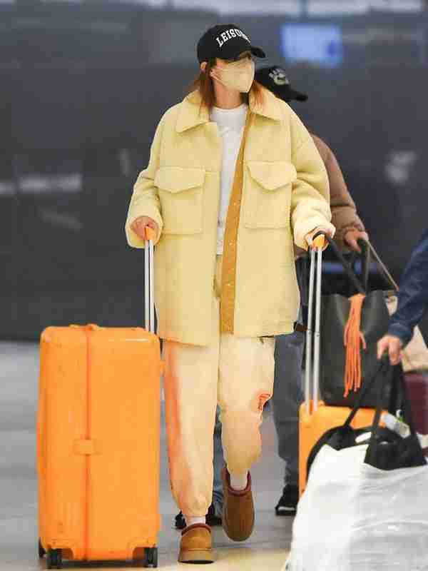 Gigi Hadid seen in an oversized yellow shearling coat